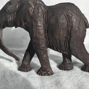 Handcrafted, hand-carved vintage wooden Elephant figurine in black wood finish, showcasing detailed craftsmanship and rustic charm